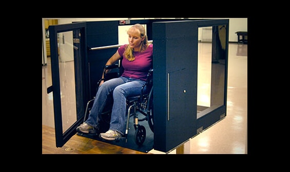 Handicapped woman using an Ascension Protege vertical wheelchair lift